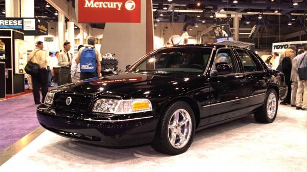 The Mercury Marauder co<em></em>ncept car in black on a show floor, front 3/4 view