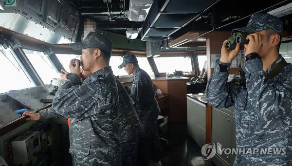 This unrelated photo, provided by the Navy on Jan. 1, 2024, shows Navy service members carrying out a security mission aboard a warship in the East Sea. (PHOTO NOT FOR SALE) (Yonhap)