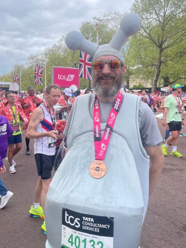Marcus Mumford, 45, after finishing the TCS Lo<em></em>ndon Marathon, dressed as a tap. Picture date: Sunday April 21, 2024. Pic: PA 
