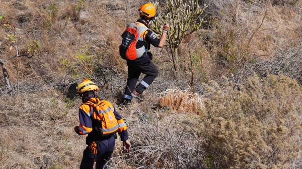 Emergency workers near the village of Masca, Tenerife.</p>
<p> Pic: PA