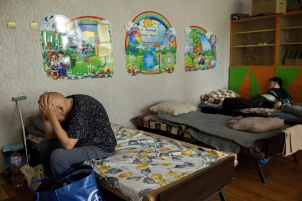 People who fled Russian shelling of villages in the Pokrovsk area sit in an evacuation centre in the Do<em></em>netsk region, Ukraine, amid Russia's attack on Ukraine, July 30, 2024. REUTERS/Thomas Peter