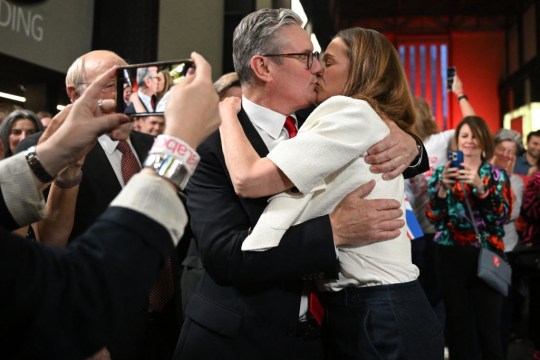 A picture of Keir Starmer kissing his wife