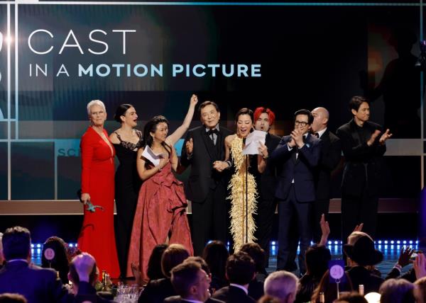 Jamie Lee Curtis, Jenny Slate, Stephanie Hsu, James Hong, Michelle Yeoh, Andy Le, Ke Huy Quan, Brian Le, and Harry Shum Jr. accept the Outstanding Performance by a Cast in a Motion Picture award for 
