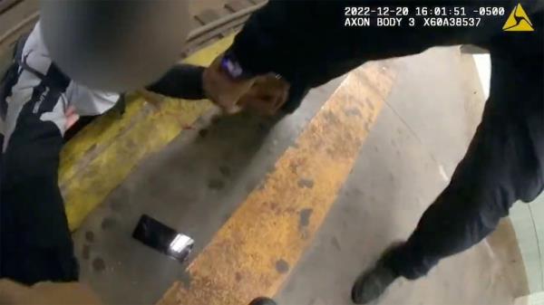 The cops are shown grabbing the 50-year-old man's arms and pulling him to safety.