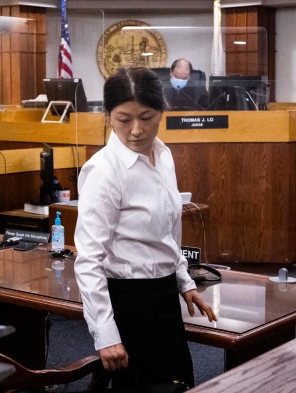 Yu, 45, leaves court at the Lamoreaux Justice Center in Orange, CA on Thursday, August 18, 2022.