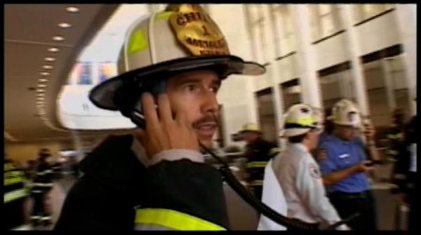 Joseph Pfeifer pictured speaking into a radio on 9/11.