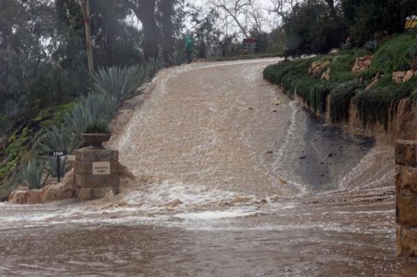 A flooded driveway of a home in Montecito.