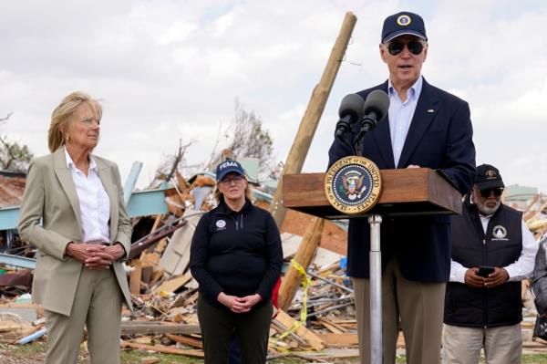 First lady Jill Biden listens as President Joe Biden speaks after surveying the damage in Rolling Fork, Miss., Friday, March 31,