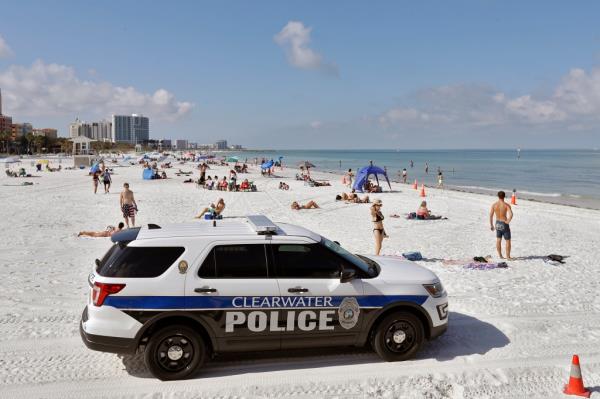 Clearwater police officers patrol the area after Clearwater Beach