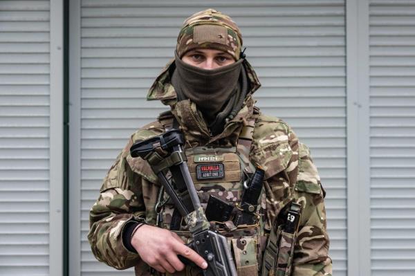 Oleksandre, a 27-year-old Ukrainian soldier, poses in the city of Chasiv Yar in eastern Ukraine on Dec. 21.