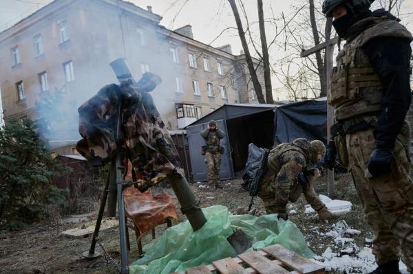 Ukrainian troops fire mortar shells at Russian positions in Bakhmut on Dec. 20.