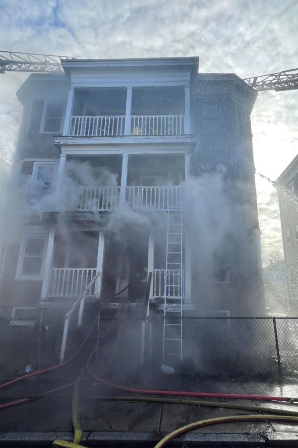 Smoke is seen coming out of the apartment building, wher<em></em>e a fire started on the first floor of the home.