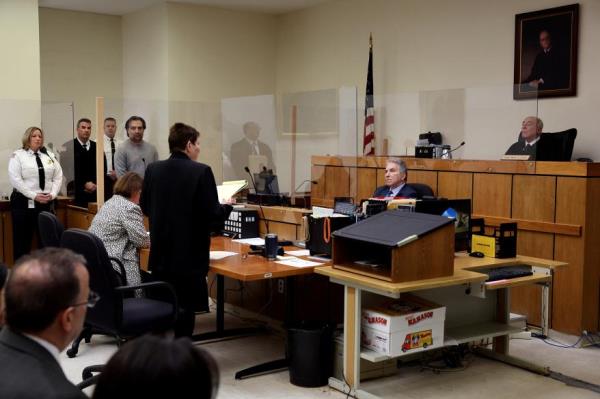 Brian Walshe listens to prosecutor Lynn Beland during his arraignment at Quincy District Court.
