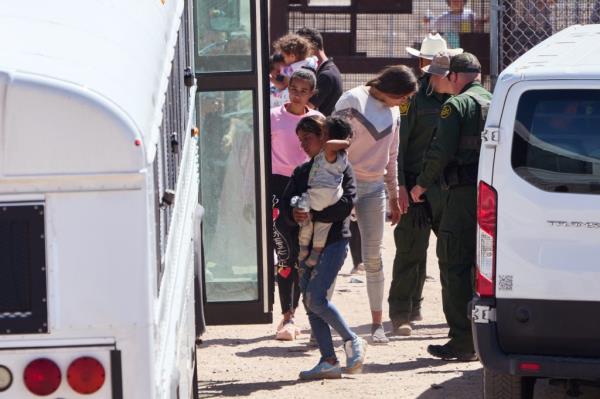 Migrants who crossed the U.S.-Mexico border are transported  by U.S. Customs and Border Protection officers for processing on Thursday, May 11, 2023 in El Paso, Texas.  