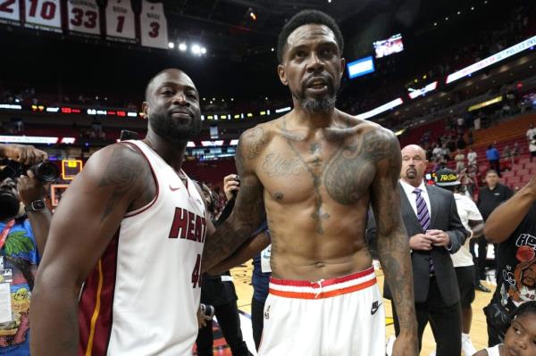 Udo<em></em>nis Haslem poses with former long-time teammate Dwyane Wade after scoring 24 points in his final NBA regular season game. Wade wore a Haslem jersey while in attendance. 