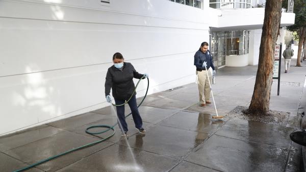 Workers clean the sidewalk area wher<em></em>e tech executive Bob Lee was stabbed to death outside of 403 Main Street in San Francisco, Calif on Tuesday morning, April 4, 2023.