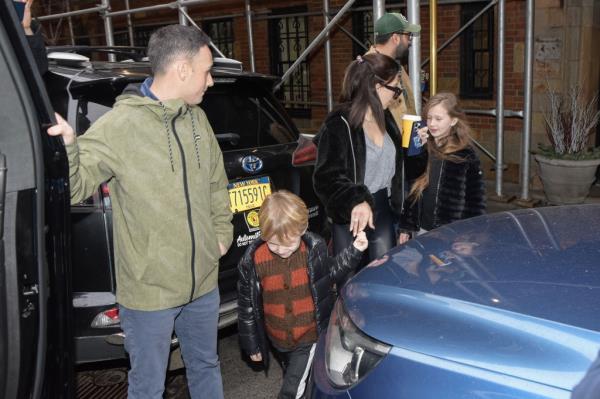 Hilaria loaded four of her children into a black SUV.