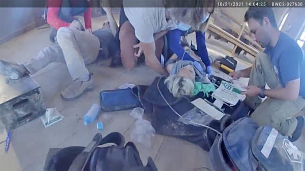 Hutchins receiving emergency medical care on set in the wake of the shooting.
