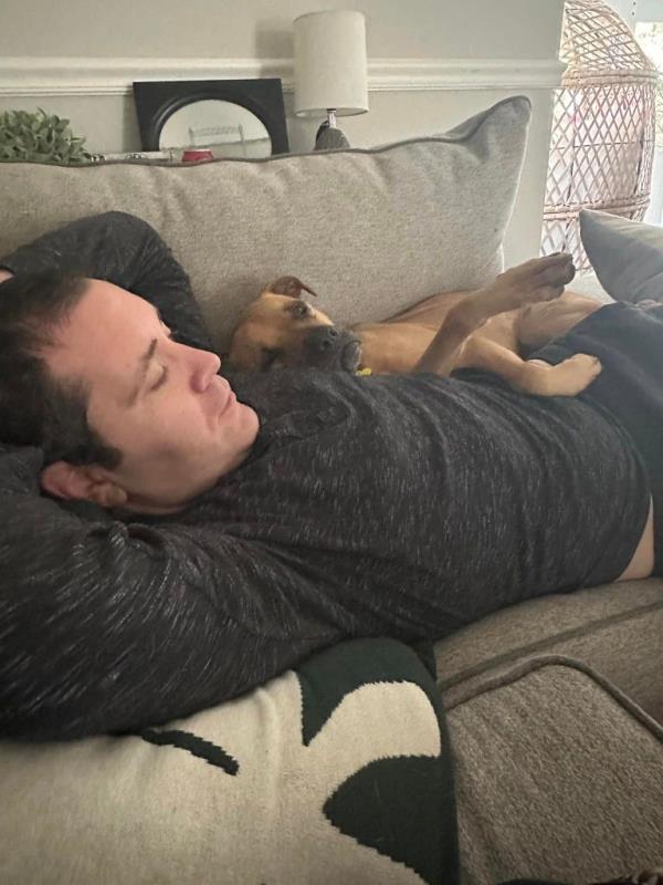 Lena lying on the couch.