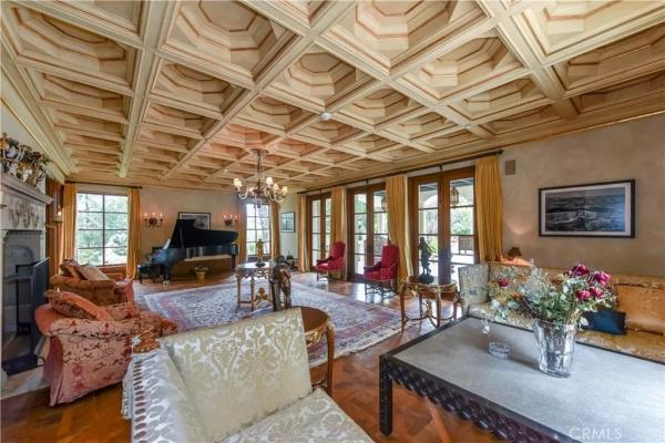 The formal living space with coffered ceilings.