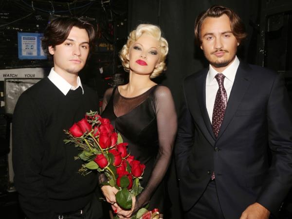 Dylan Jagger Lee (left), Pamela Anderson and Brandon Thomas Lee backstage at NYC's Ambassador Theater in 2022, wher<em></em>e Anderson made her Broadway debut as Roxie Hart in 