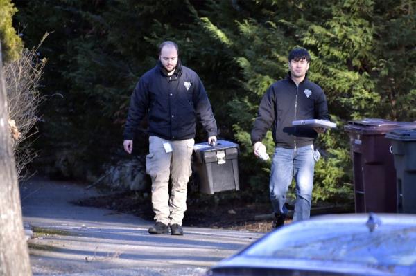 State police Crime Lab investigators outside of the Walshes' home in Cohasset.