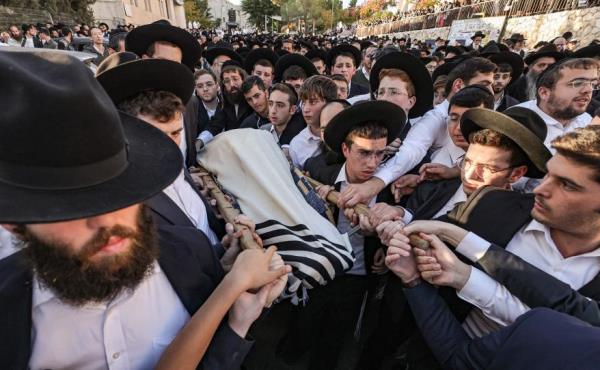 Mourners carry the body of Aryeh Shechopek during his funeral Wednesday.