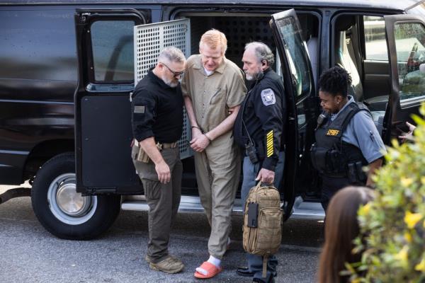 Alex Murdaugh being led into the Colleton County Courthouse in South Carolina during his 2023 trial.