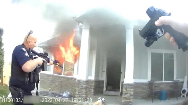 Body cam footage showing orange flames in the house.