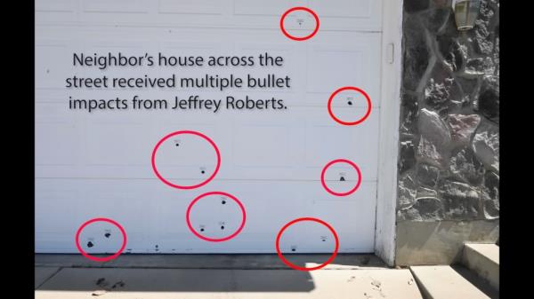 The bullet-ridden garage door.