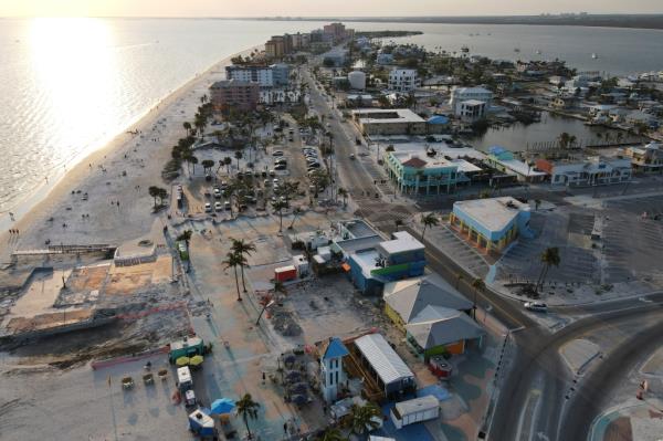 In this photo taken with a drone, restaurants operate from food trucks with outdoor seating in the Times Square area, in Florida.