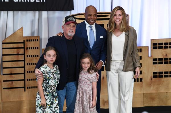 Billy Joel poeses with Mayor Eric Adams, Alexis Roderick, Della Rose Joel and Remy Anne Joel.
