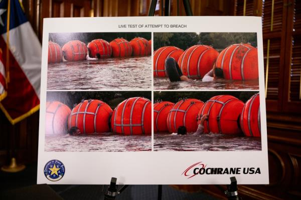 A poster illustrating new border security implementation is displayed during a news co<em></em>nference at the Texas State Capitol on June 8, 2023, in Austin, Texas. 