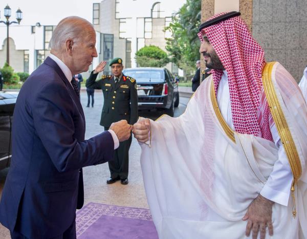 FILE - In this image released by the Saudi Royal Palace, Saudi Crown Prince Mohammed bin Salman, right, greets President Joe Biden with a fist bump after his arrival at Al-Salam palace in Jeddah, Saudi Arabia, July 15, 2022.