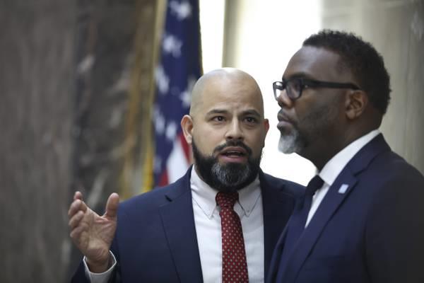 Ald. Andre Vasquez Jr., 40th, speaks with Mayor Brandon Johnson during a City Council meeting at City Hall on Dec. 13, 2023. 