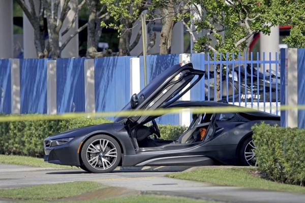 FILE - An empty vehicle appears on a street wher<em></em>e rapper XXXTentacion was shot on Monday, June 18, 2018, in Deerfield Beach, Fla. 