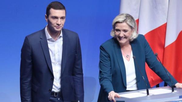 French Education and Youth Minister Gabriel Attal (L) looks at France's President Emmanuel Macron (R) addressing the audience at the 'lycée professio<em></em>nnel de l'Argensol' or Argensol vocatio<em></em>nal school during his visit of the school in Orange, Southeastern France on September 1, 2023
