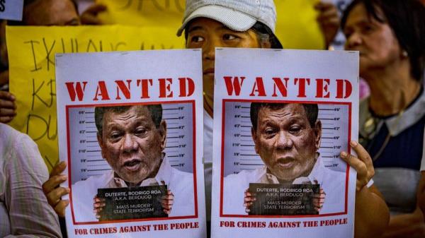 Activists take part in a protest outside the Quezon City Prosecutor's Office which summo<em></em>ned former President Rodrigo Duterte over a criminal complaint filed against him, on December 04, 2023 in Quezon City, Philippines.