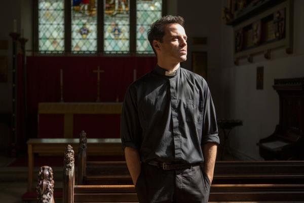 Andrew as the hot priest in Fleabag