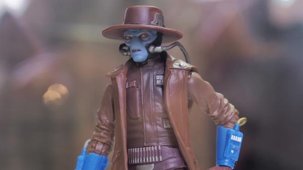 An action figure of Cad Bane stands ready