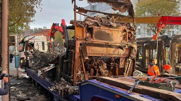 Burnt out bus and smashed windows on the Luas on O’Co<em></em>nnell Street, Dublin, Ireland.