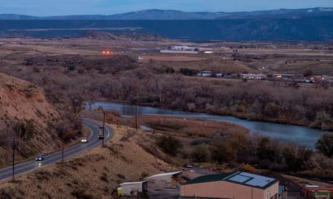 Lights from the Rifle Garfield County Airport shine, at center, as dusk falls in Rifle, Colo., on Wednesday, Nov. 1, 2023.