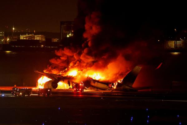 FILE PHOTO: Japan Airlines' A350 airplane on fire at Haneda internatio<em></em>nal airport in Tokyo