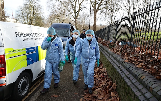 Police and forensic officers at the scene in Primrose Hill, north London, after a teenager was stabbed to death on New Year’s Eve