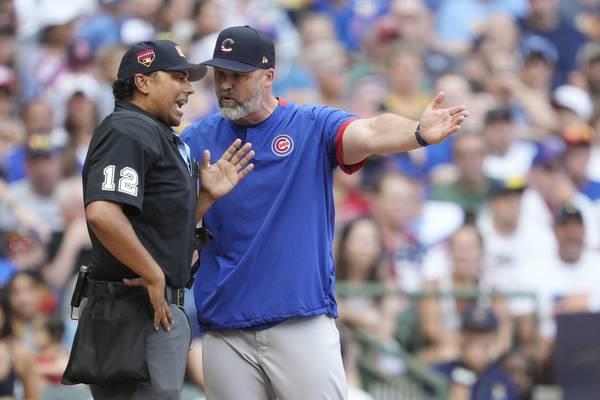 Cubs manager David Ross argues with plate umpire Erich Baccus after a call in the sixth inning against the Brewers on July 4, 2023, in Milwaukee.