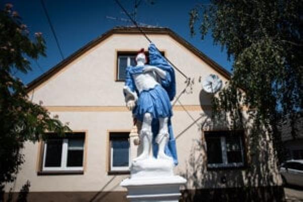 The damaged statue of St. Florian.