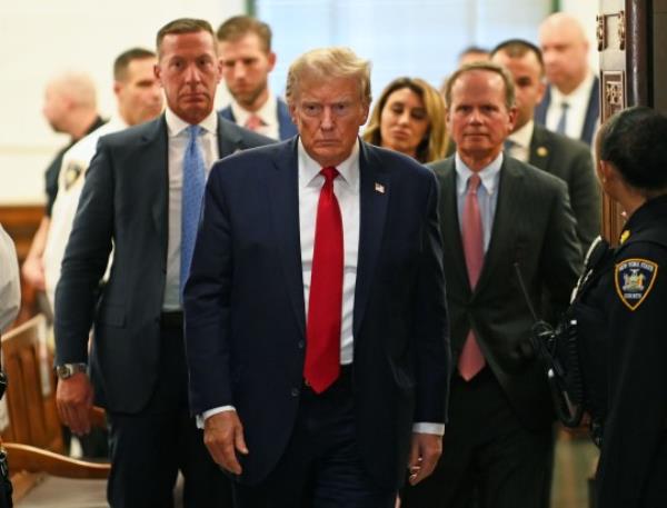Former President Do<em></em>nald Trump appears at his o<em></em>ngoing civil fraud case to watch the latest witness in the trial at New York Supreme Court 