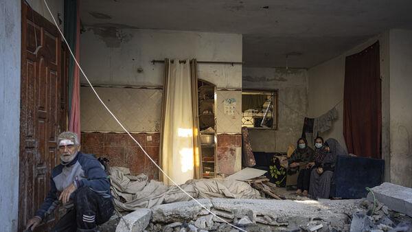 Displaced Palestinians flood southern Gaza town as Israel expands offensive