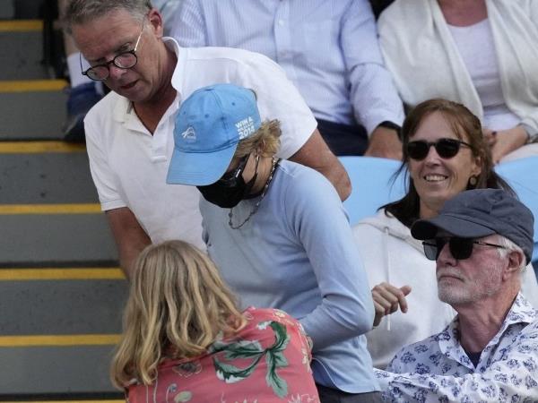 A woman, centre, is taken away after throwing “Free Palestine” leaflets o<em></em>nto Margaret Court Arena during the fourth round match between Alexander Zverev of Germany and Cameron Norrie of Britain at the Australian Open tennis champio<em></em>nships at Melbourne Park, Melbourne, Australia, Monday, Jan. 22, 2024.