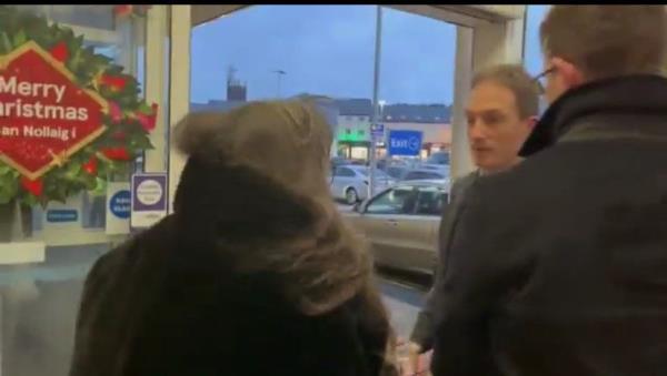 Members of the Burke family co<em></em>nfront TD Alan Dillon in a supermarket in Castlebar on Christmas Eve.